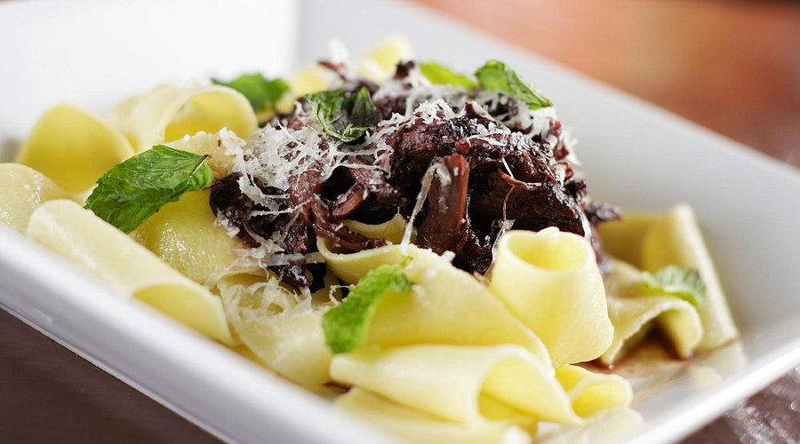 Italia Trattoria signature dishes House-made pastas like Carbonara and Bolognese, Risotto, Polenta, and seasonal meat and fish entrees.